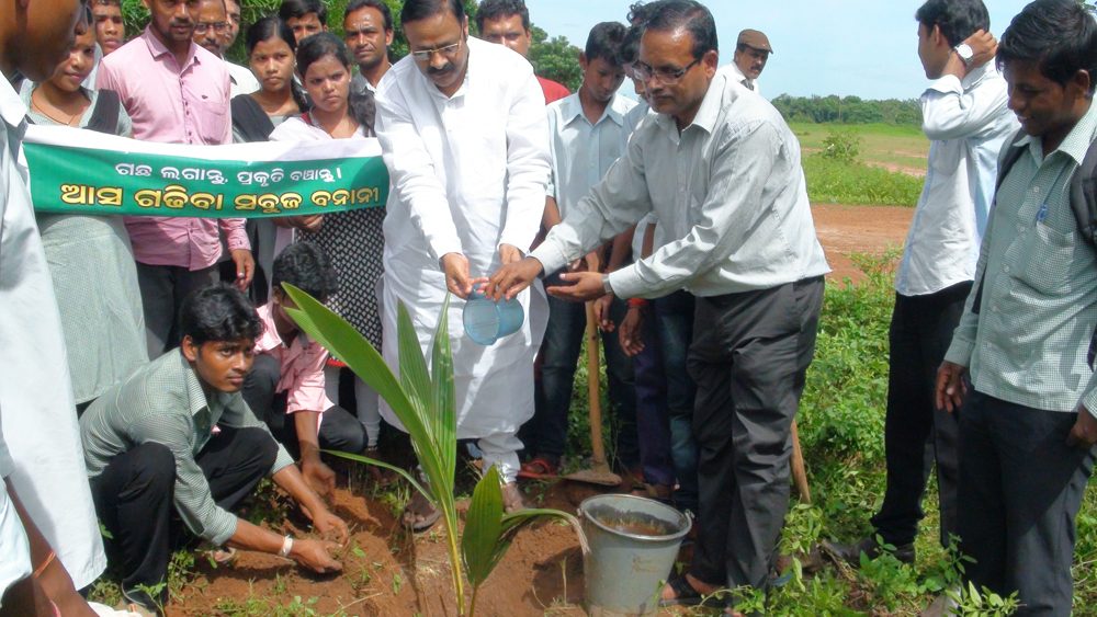 Murali Sharma plants tree in the premises of Kuhudi College, Khurda to mark Modi Jayanty